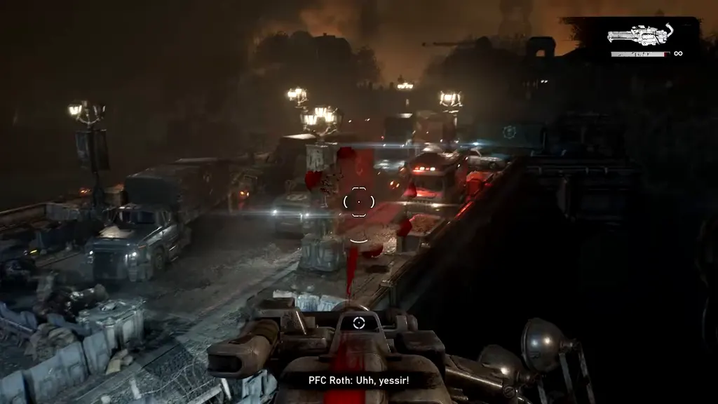 Firing a mounted gun down a road full of wrecked trucks