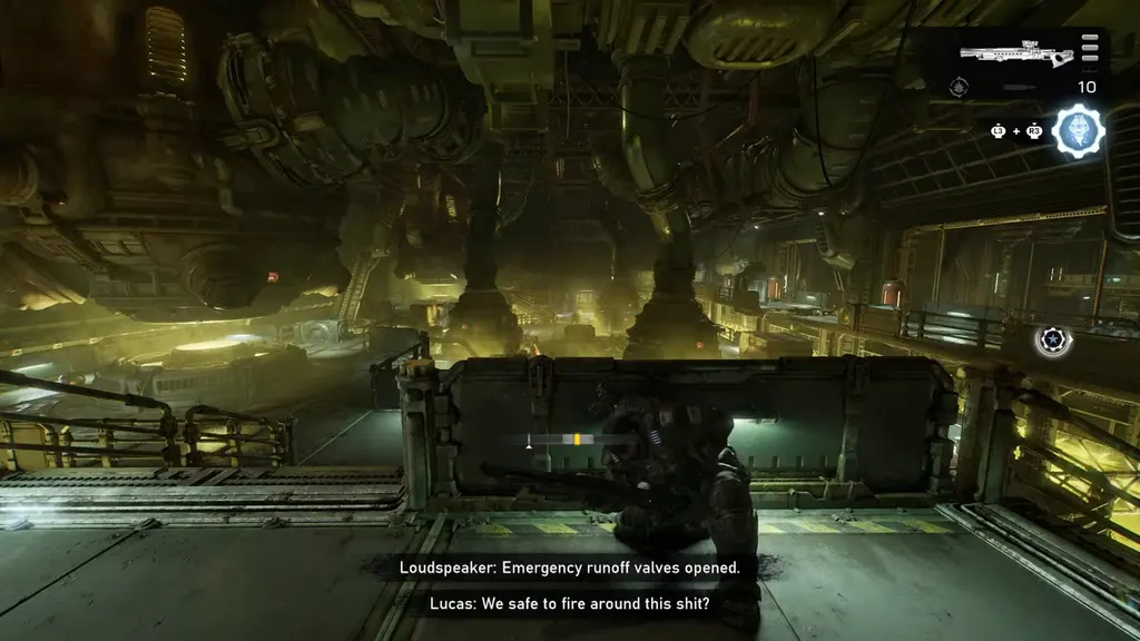 The yellow-lit pipeline hall inside the refinery