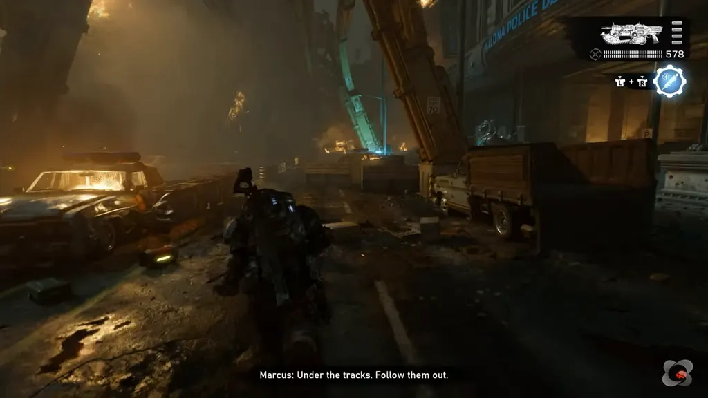 Walking past burning cars under the elevated tracks