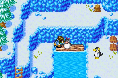 Pushing the penguin across the log