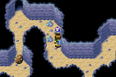 Lifting a boulder in the lower caves