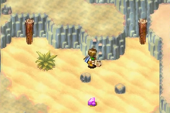 The Psynergy Stone below the three stakes