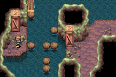 A pillar and a crate by the water in Vale Cave